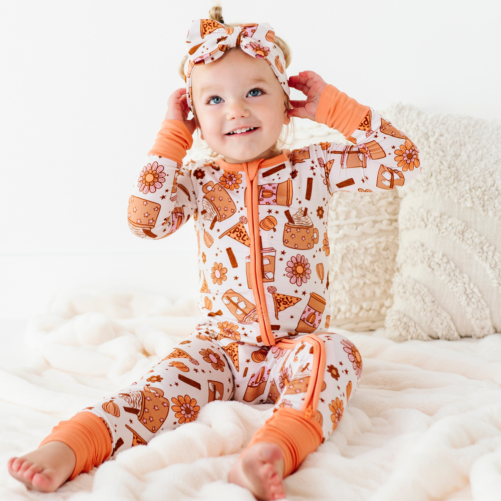 
                      
                        Baby in Pumpkin Spice Latte Pajamas by Kiki and Lulu
                      
                    