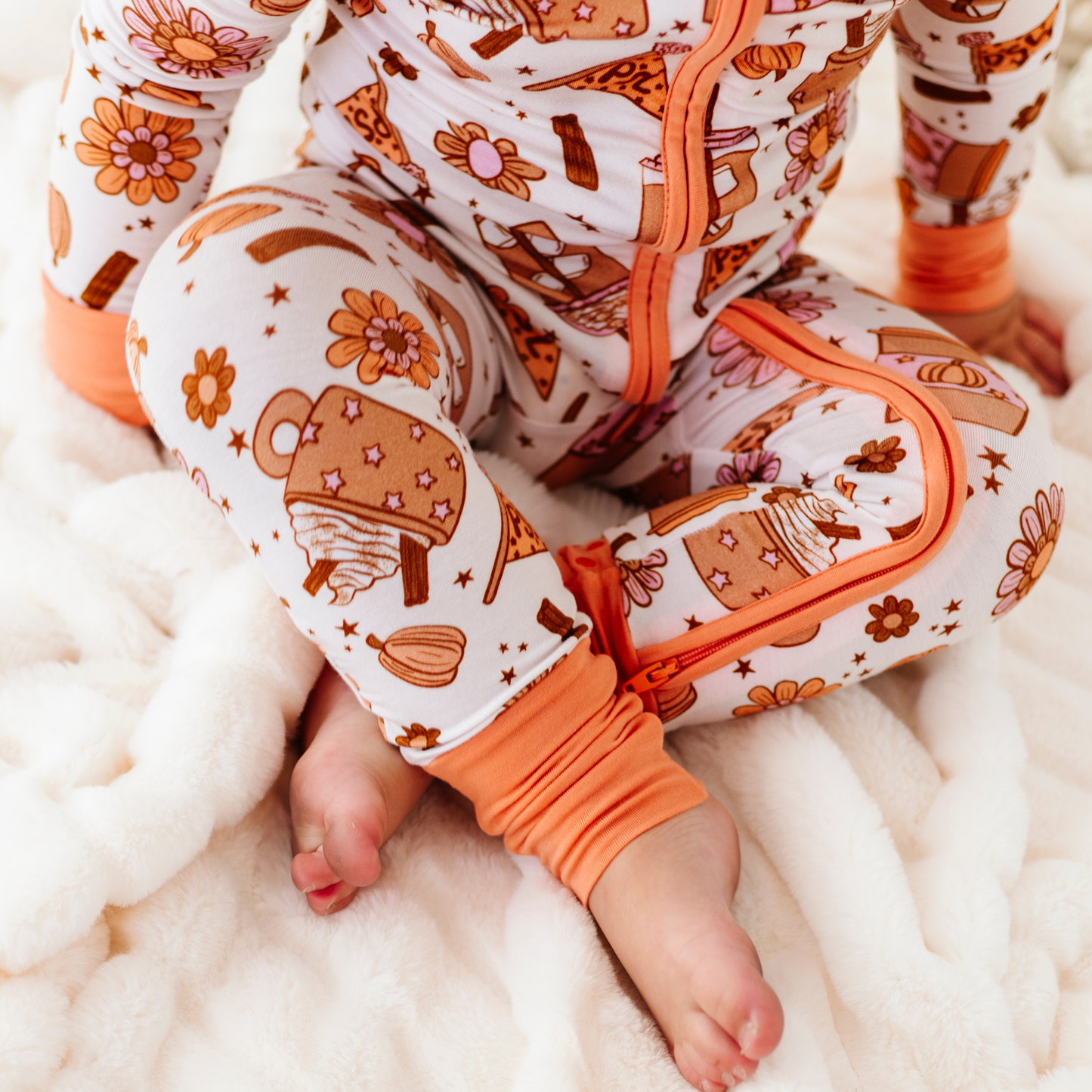 Baby in Pumpkin Spice Latte Pajamas by Kiki and Lulu