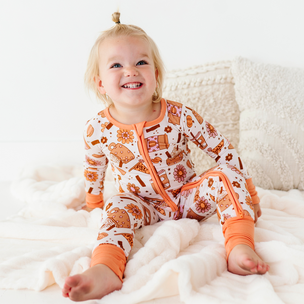 
                      
                        Baby in Pumpkin Spice Latte Pajamas by Kiki and Lulu
                      
                    