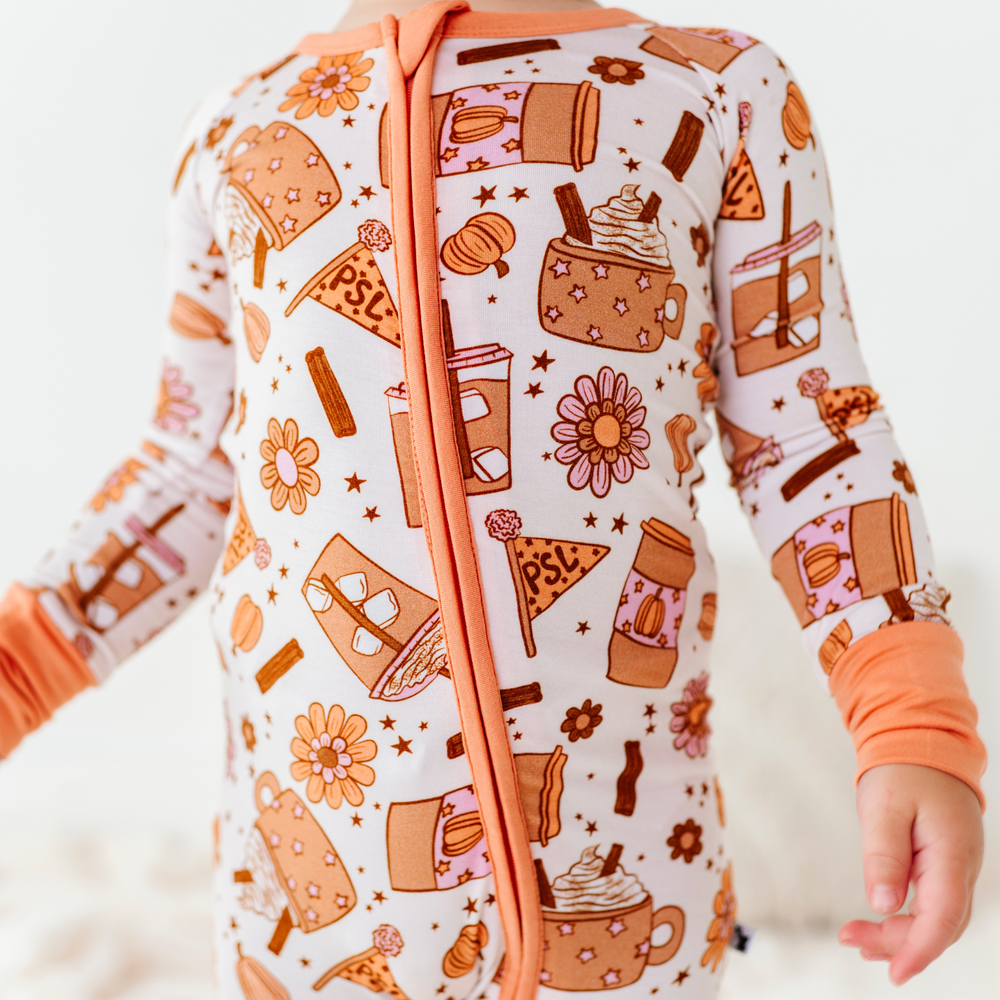 
                      
                        Baby in Pumpkin Spice Latte Pajamas by Kiki and Lulu
                      
                    