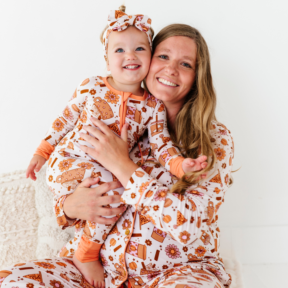 
                      
                        Baby in Pumpkin Spice Latte Pajamas by Kiki and Lulu
                      
                    