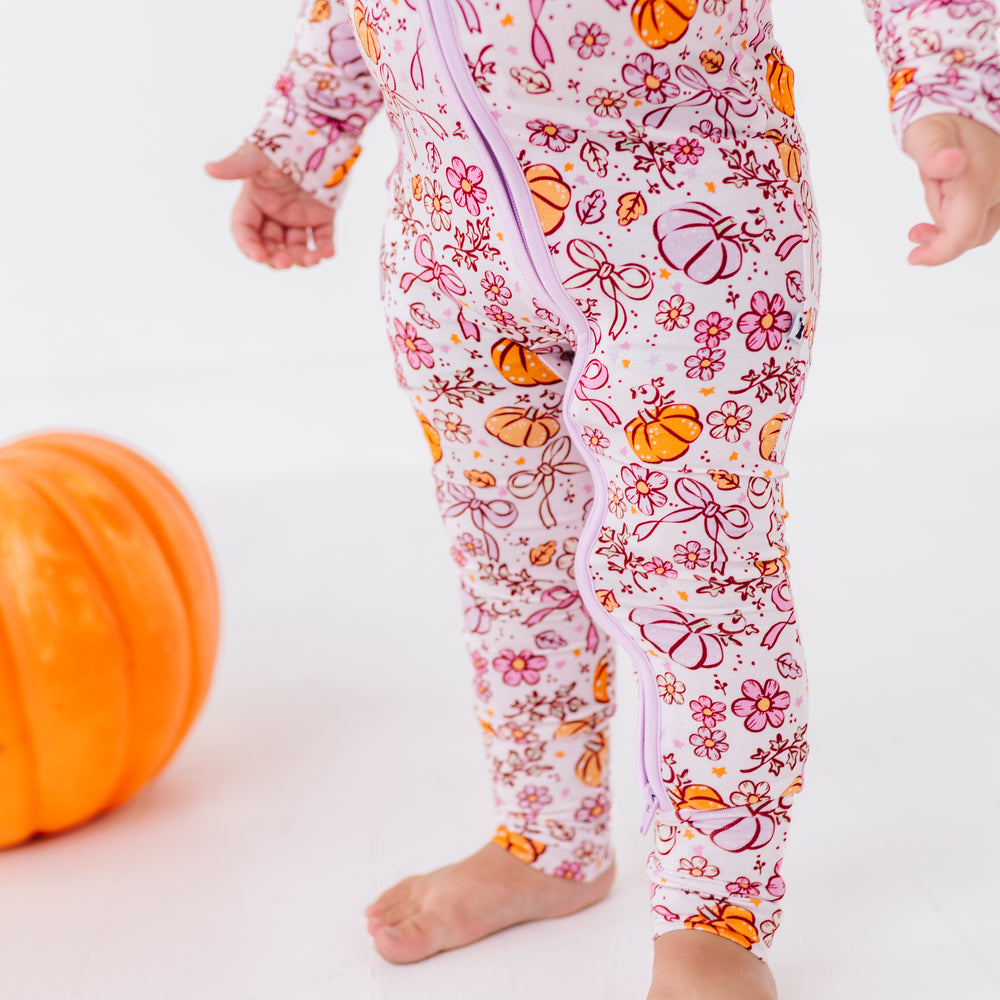 
                      
                        Girl in Purple Pumpkin and Bow Pajamas
                      
                    