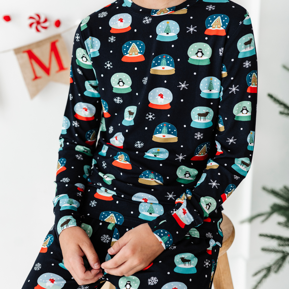 Boy in Kiki and Lulu Christmas Family Matching Snow Globe Pajamas