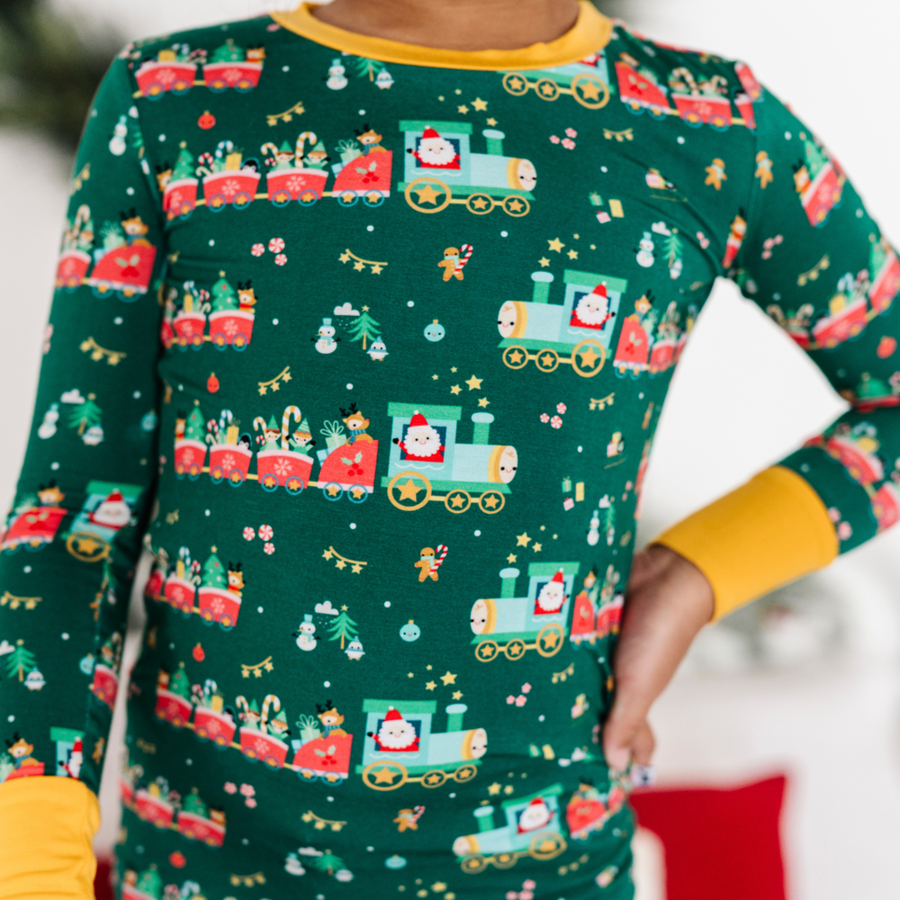 Toddler in Christmas train pajamas 