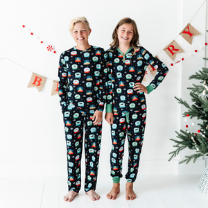 
                
                    Load image into Gallery viewer, Girl in Kiki and Lulu Snow Globe Christmas Family Matching Pajamas 
                
            