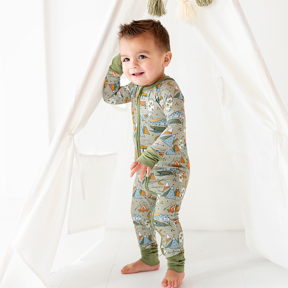 
                
                    Load image into Gallery viewer, Baby wearing convertible footies with camping print
                
            
